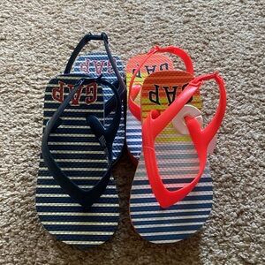 2 pairs Gap flip flops sz 10. NWOT blue/white striped. NWT neon orange striped.
